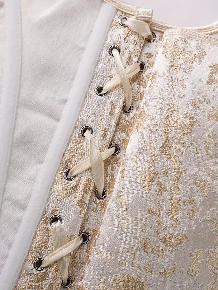 Un corset à double bandoulière en brocart doré de style court rétro