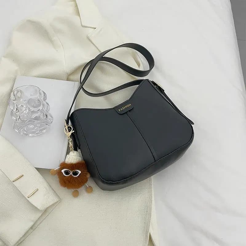 Sac seau confortable et polyvalent avec design ergonomique pour les voyageurs